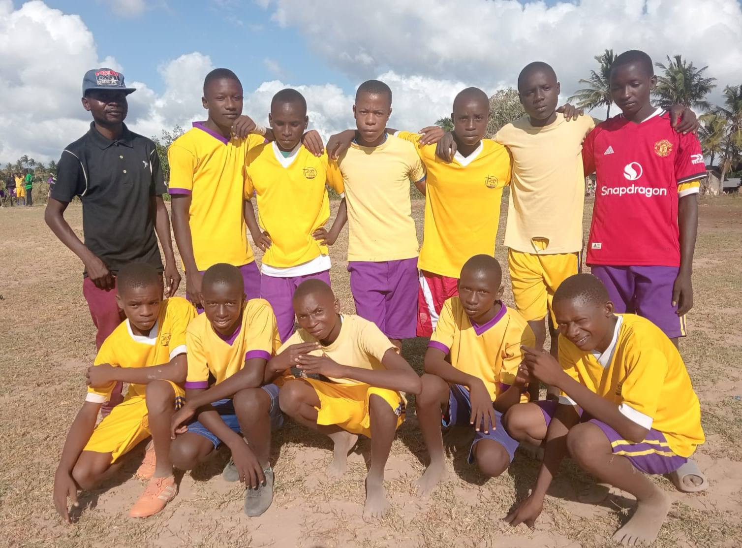 Youth football team in yellow uniforms